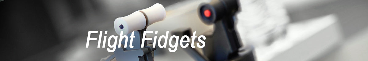 A close-up of a mechanical device with a white handle and a blurred background, overlaid with the text "Flight Fidgets" in bold white letters.