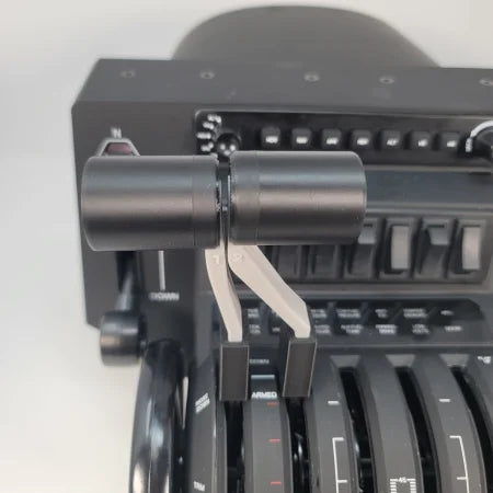 Close-up of a Prodesksim Honeycomb Bravo G58 Baron twin engine piston throttle quadrant, showcasing two distinct handles, labeled "1" and "2," for throttle control, fuel mixture, and prop pitch. A variety of switches and dials populate the background, evoking a realistic flight simulation upgrade.