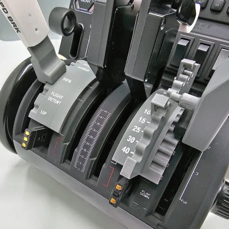 Close-up of the Prodesksim Boeing 737 Dual Action Detent/Spring mechanism addon for Honeycomb Bravo, featuring a realistic design with detailed throttle levers and control markings such as "Flight Detent" and percentage indicators. Various switches, flap settings, and dual action design are prominently showcased among the grey and black components.