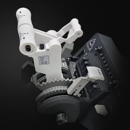 Close-up of the Prodesksim New ProDeskSim 737 Ultra Full Package Addon control unit, featuring labeled white joystick handles and multiple switches, dials, and buttons, resembling a Throttle Quadrant on a deep black background.