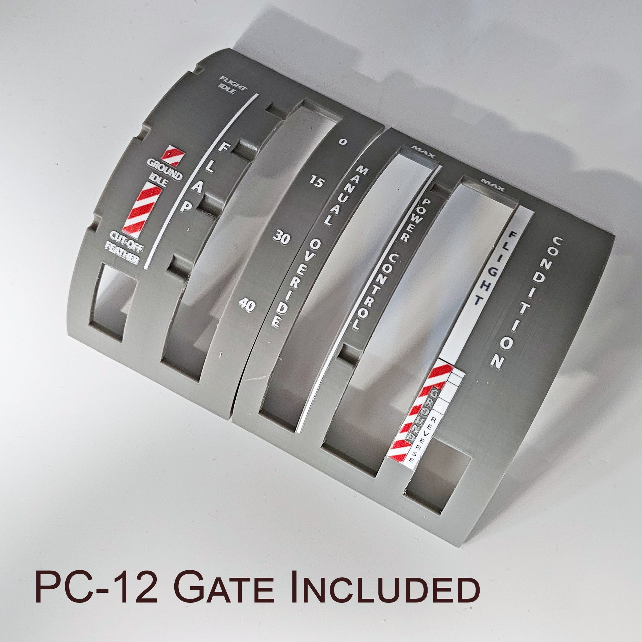 Enhance your flight simulation experience with a close-up of the aircraft control panel labeled "PC-12 Gate Included," from the NEW! ProDeskSim Pilatus PC-12 Addon/Mod package for Honeycomb Bravo Throttle Quadrant by Prodesksim. It features levers for ground, flap, manual override, power control, and flight condition, each with marked scales and stripes. Ideal Honeycomb Bravo addon!