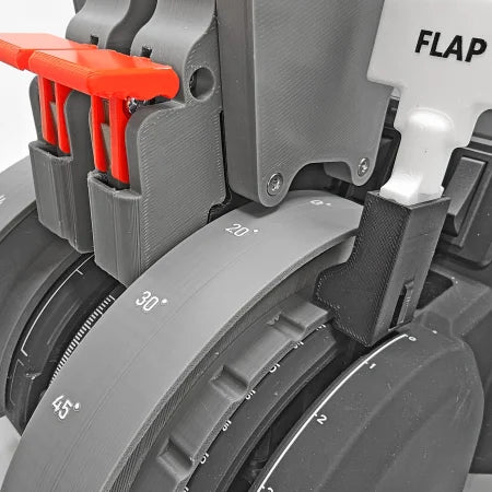 The Prodesksim NEW Game Changing Challenger 6xx Addon for Honeycomb Bravo Throttle Quadrant features a close-up of a mechanical device with circular components displaying degree measurements (20°, 30°, 45°). It includes distinctive elements such as the red lever and sections labeled "FLAP," highlighting its industrial design and precision engineering, ideal for an authentic flight simulation experience.