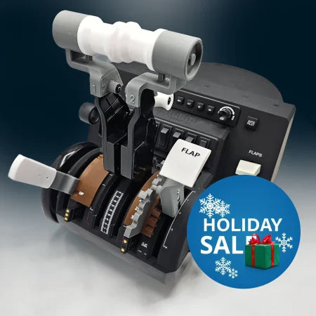 Close-up of a flight simulator control panel, featuring throttle levers, switches, and a labeled flap control. The sleek black design showcases Prodesksim's Boeing 757/767 Dual Action throttle pack/mod for the Honeycomb Bravo throttle quadrant with multiple gauges and the industry standard roller detent for precise operation.