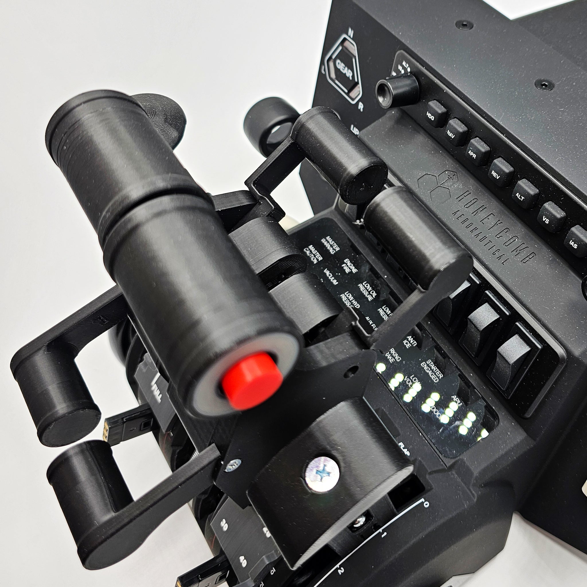 Close-up of the Prodesksim Iconic First Ever Airbus A300/310 Addon Package for Honeycomb Bravo, featuring 2 functional AP/AT Disc buttons and 2 reversers—perfect for flight simulation realism against a plain white background.