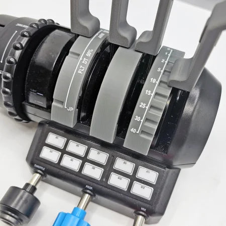 Close-up of an aircraft throttle quadrant equipped with multiple levers and switches, resembling the Boeing 737 Functional Addon for Turtle Beach Velocity One by Prodesksim. The levers are labeled with flap settings and angles, while the control panel features several white buttons and switches, similar to those on the Turtle Beach Velocity One for flight simulation.