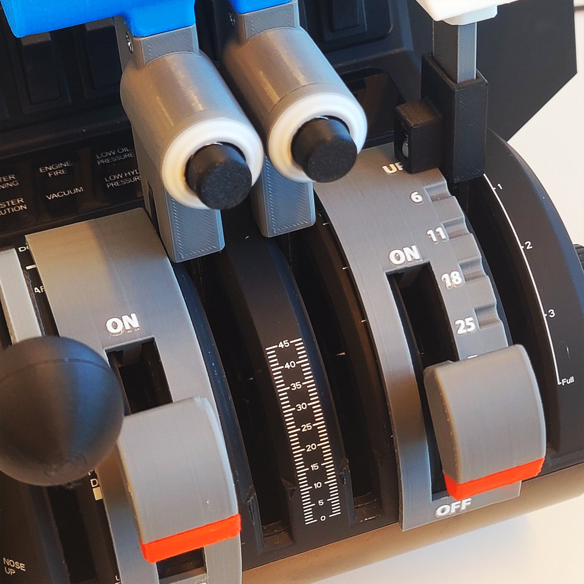 A close-up of an aircraft throttle quadrant showcases the NEW! ProDeskSim Fokker 28 add-on for the Honeycomb Bravo. The image highlights two throttle levers with gray handles set against a black background. These levers are marked with increments and labeled "ON" and "OFF" at their base, featuring additional controls as part of this ProDeskSim add-on, which includes six levers, detent flaps, and two functional buttons.