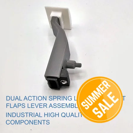 A gray metal dual-action spring-loaded lever assembly featuring a textured grip and a white square mounting plate is displayed on a light surface. Blue text reads: "Boeing 737/757/767/777/787 Spring realistic and professional Spring Loaded flaps from Prodesksim." Ideal for enhancing flight simulation realism and Honeycomb Bravo addons.