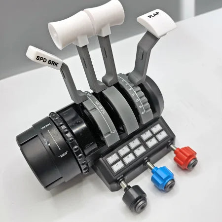 A close-up of the Prodesksim Boeing 737 Functional Addon for Turtle Beach Velocity One shows labeled SPD BRK and FLAP levers, multiple buttons, and three colored knobs on a white surface—perfect for flight simulation enthusiasts.