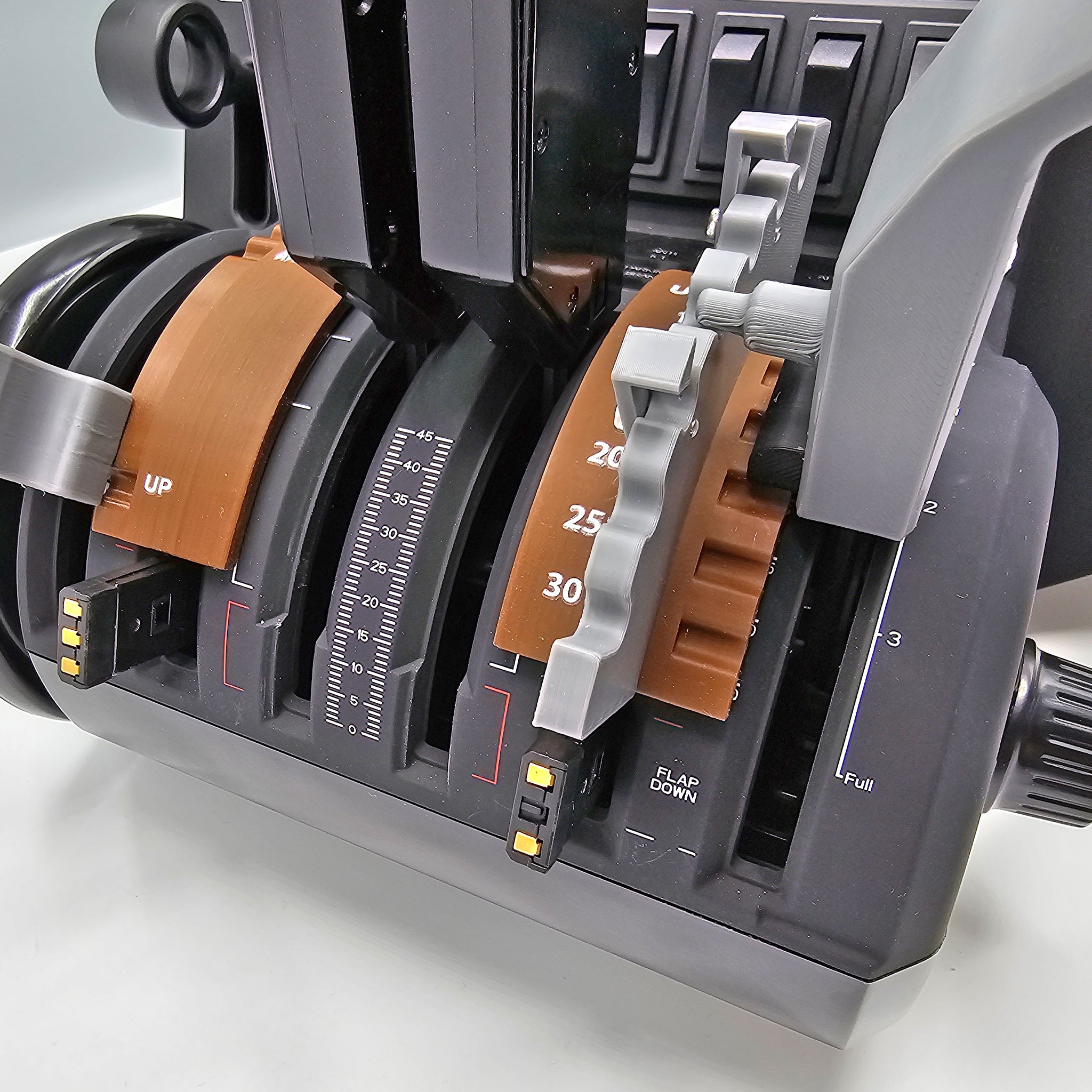 Close-up of a throttle quadrant from an aircraft cockpit simulator, featuring the Boeing 757/767 Dual Action throttle pack/mod for the Honeycomb Bravo by Prodesksim. It includes multiple levers with numbered labels, a gear-like mechanism in view, and marked positions for flap settings, all embodying an industry-standard roller detent design.