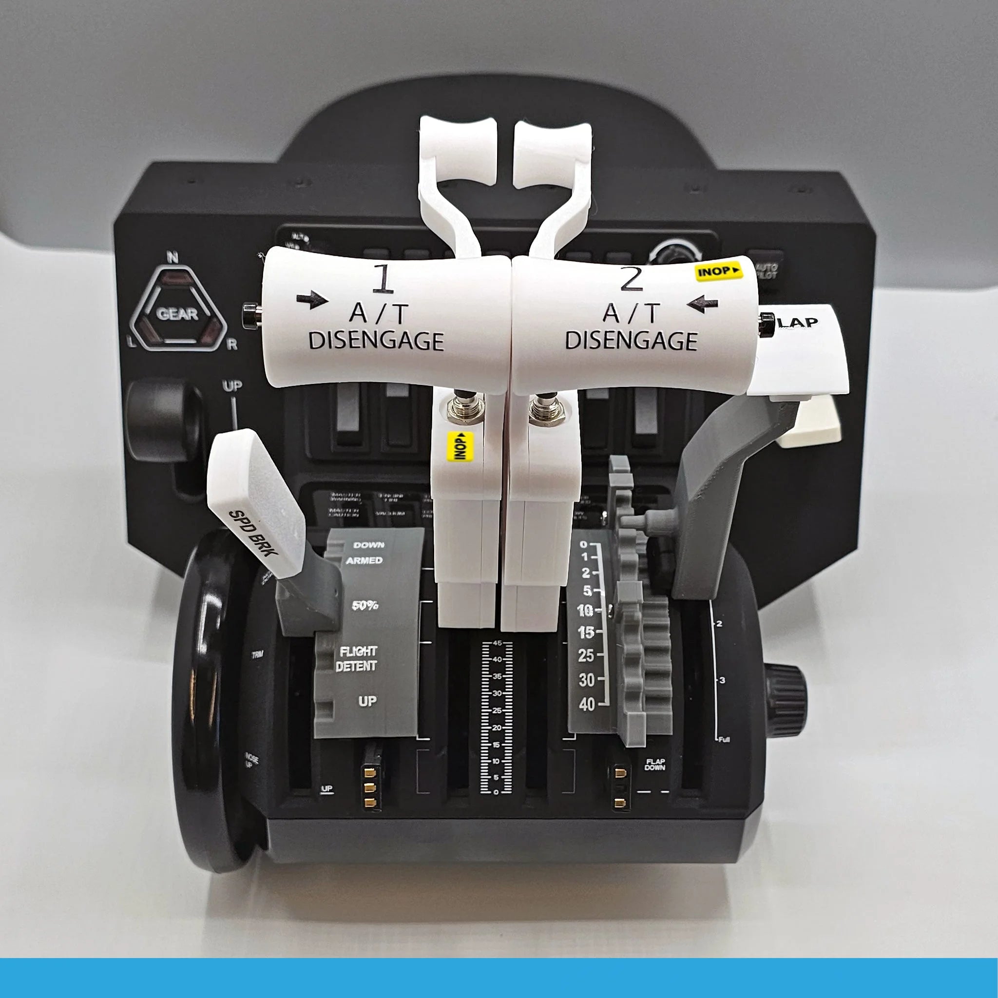 A detailed view of the ProDeskSim Boeing 737 Advanced Full Package Addon/Modification for the Honeycomb Bravo throttle quadrant highlights various levers and controls, featuring gear and flap levers along with clearly labeled autopilot disengage switches. Ideal for an immersive flight simulation experience, this device by Prodesksim is elegantly displayed on a simple surface.