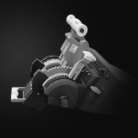 An abstract, mechanical sculpture resembling the ProDeskSim 737 Ultra Full Package Addon, featuring gears and levers against a black background. The predominantly gray and white components of the Prodesksim brand create a striking contrast.