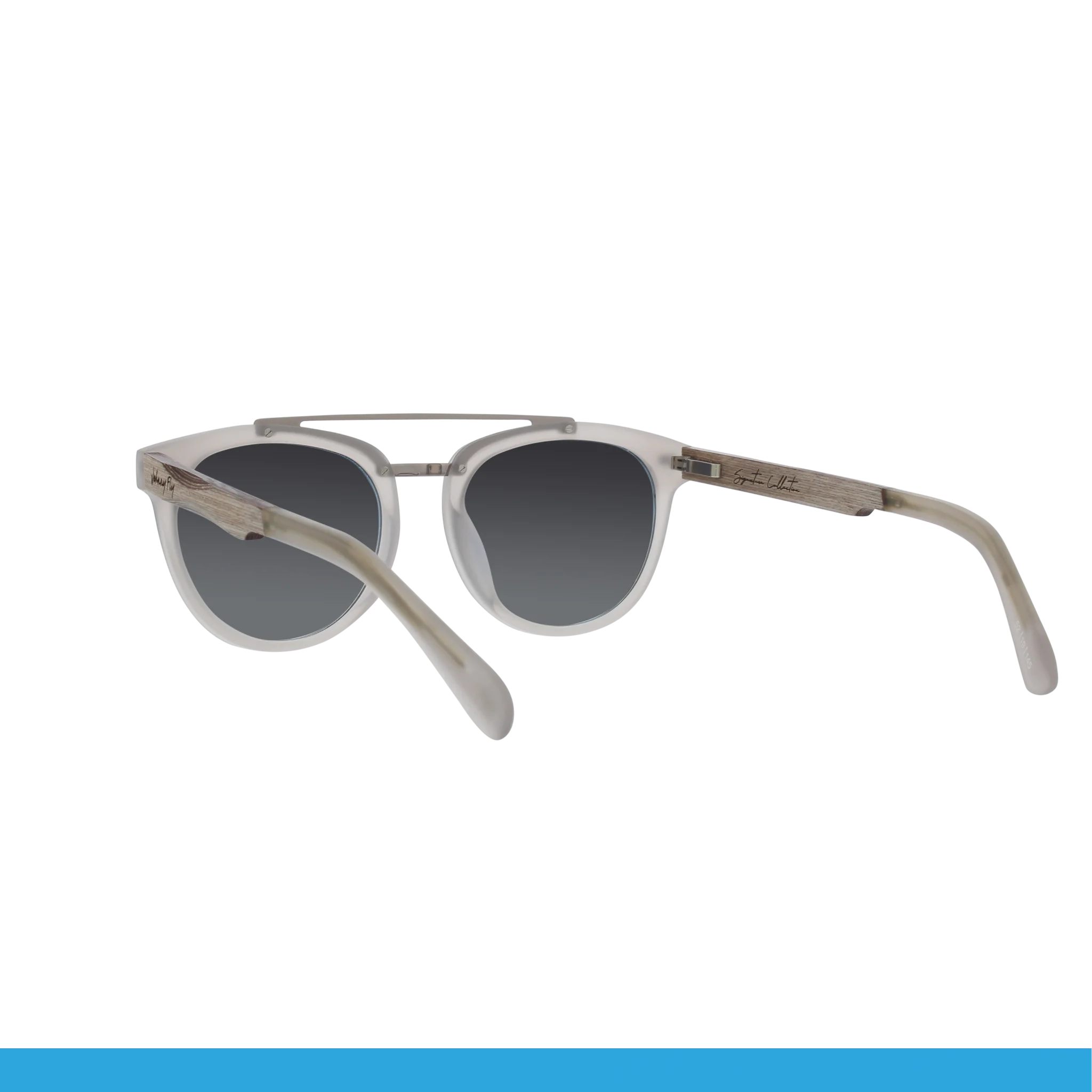 The Johnny Fly Captain sunglasses showcase an acetate front section, gray gradient lenses, and wooden-textured arms, elegantly displayed against a plain black backdrop.