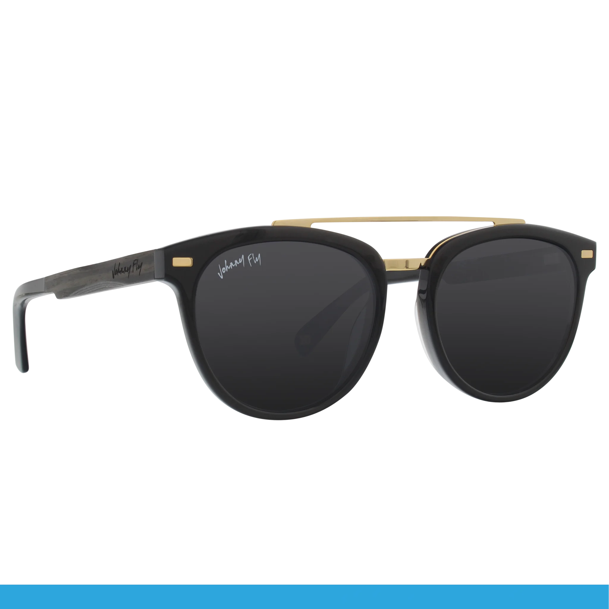 Presenting the Captain by Johnny Fly: a pair of stylish sunglasses with dark lenses and a black frame featuring an acetate front section. The temples have a metallic finish with a signature inscribed on them, complemented by wooden arms. The bridge is adorned with a gold accent.