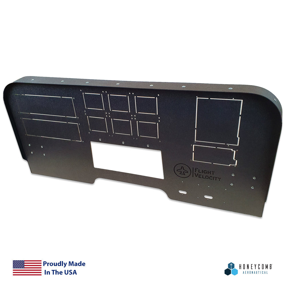 A black FV8H - Mid Profile 750/650 Cockpit Panel designed for placing instruments, complete with logos from "Flight Velocity," "Honeycomb Aeronautical," and "Honeycomb Alpha Flight Controls." It displays an American flag graphic and text that proudly state it's made in the USA.