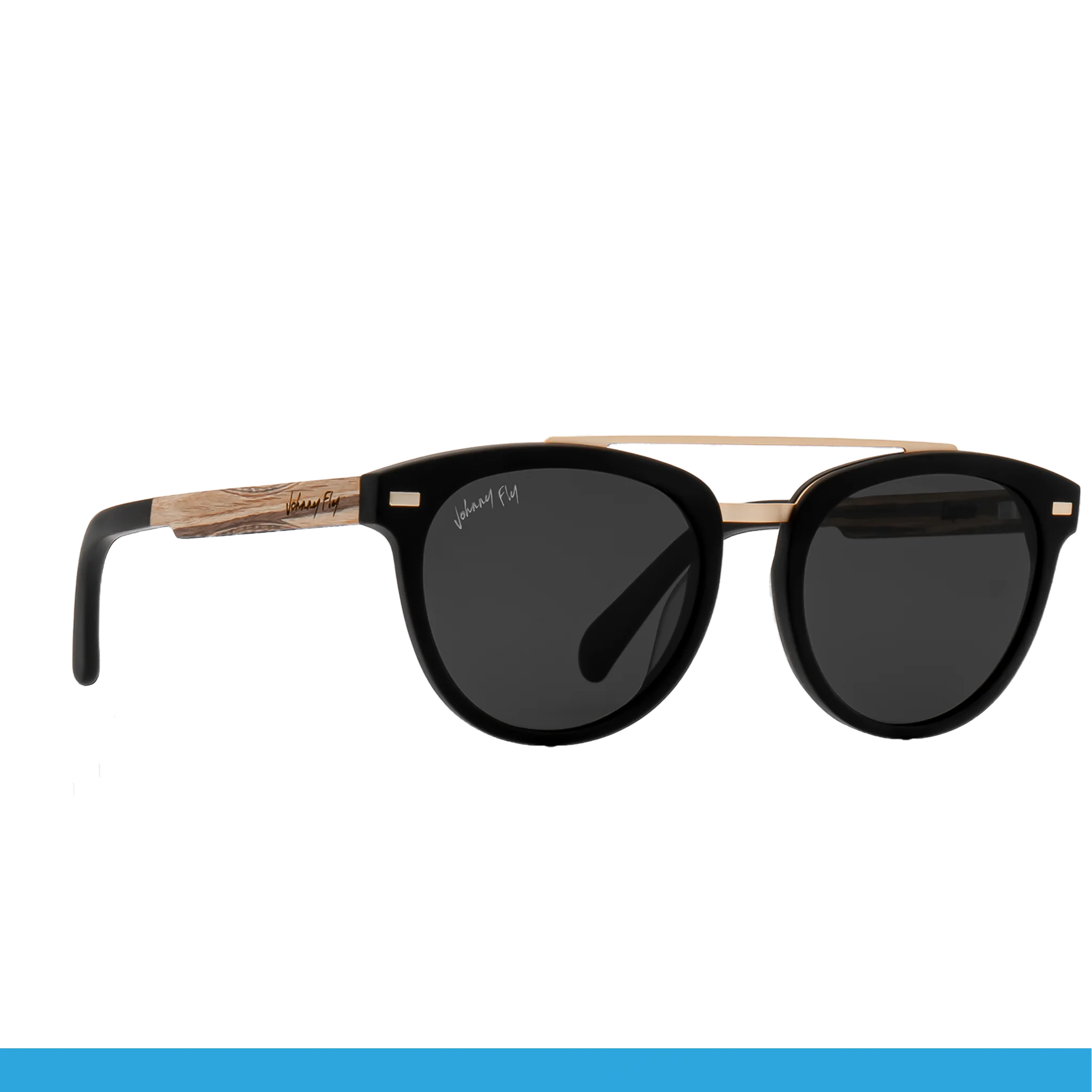 Introducing the Captain by Johnny Fly: a pair of stylish black sunglasses that feature dark polarized lenses and gold accents on the acetate front section. The temples showcase a wood-like texture and include a small inscription, adding an elegant touch.