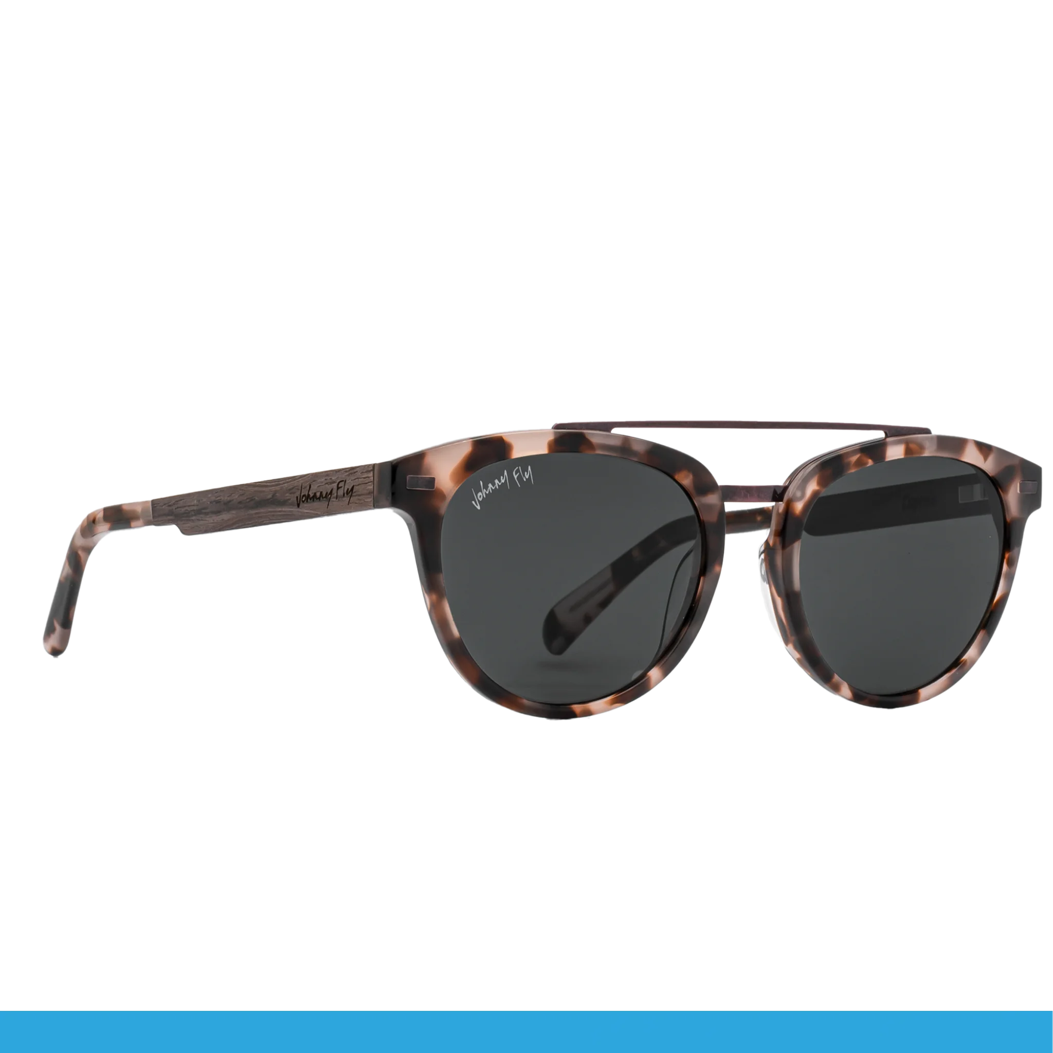 Introducing the Captain sunglasses by Johnny Fly, featuring a tortoiseshell design with an acetate front section. These stylish shades come with dark round polarized lenses and brown wooden arms, showcasing the brand's logo prominently on the arm. The design expertly fuses classic and modern aesthetics.