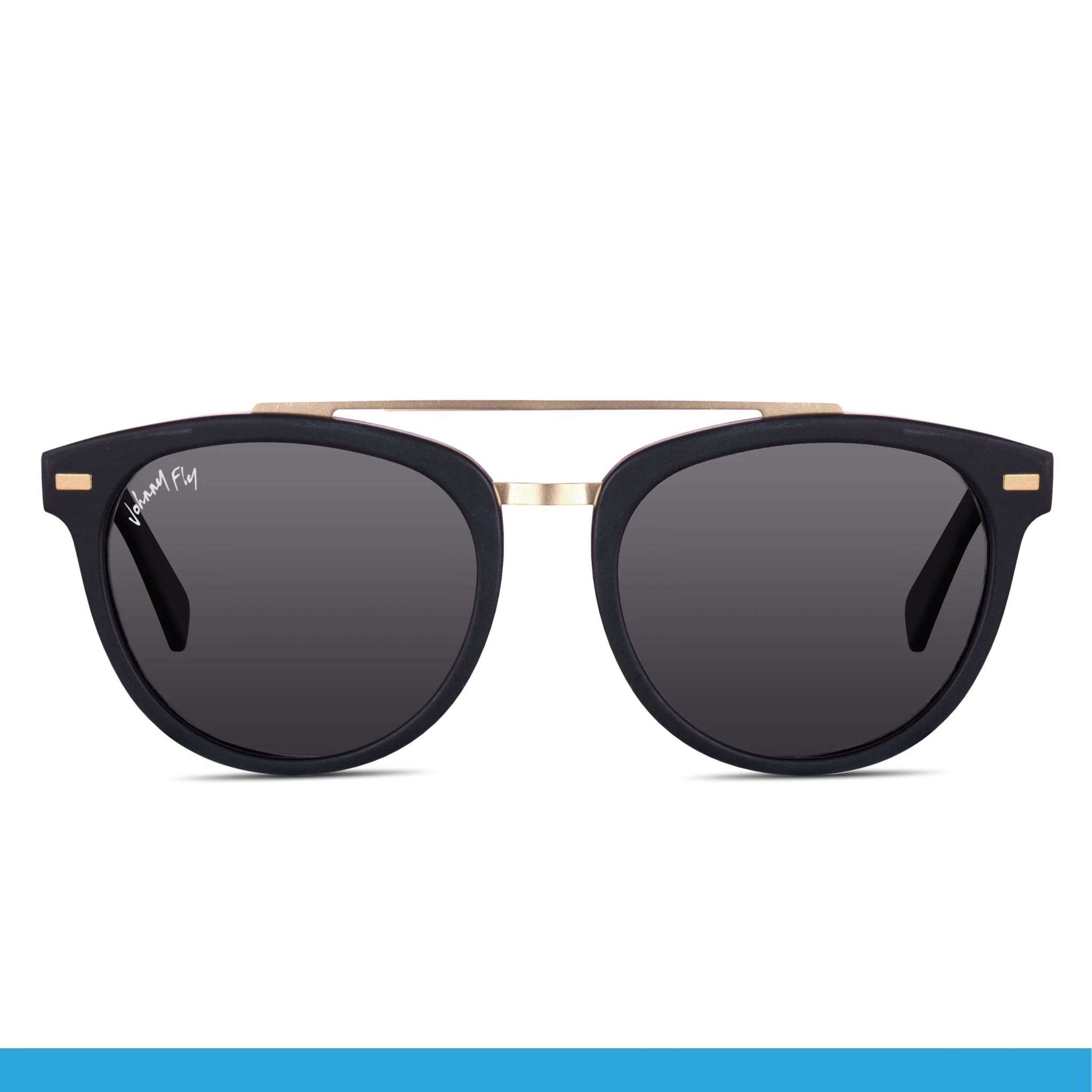 Introducing the Captain by Johnny Fly: These stylish sunglasses feature black frames with polarized lenses. The bridge and temples boast gold accents, and the elegant wooden arms add a touch of sophistication. The durable acetate front section ensures longevity, while the brand name is elegantly displayed on the upper left lens.