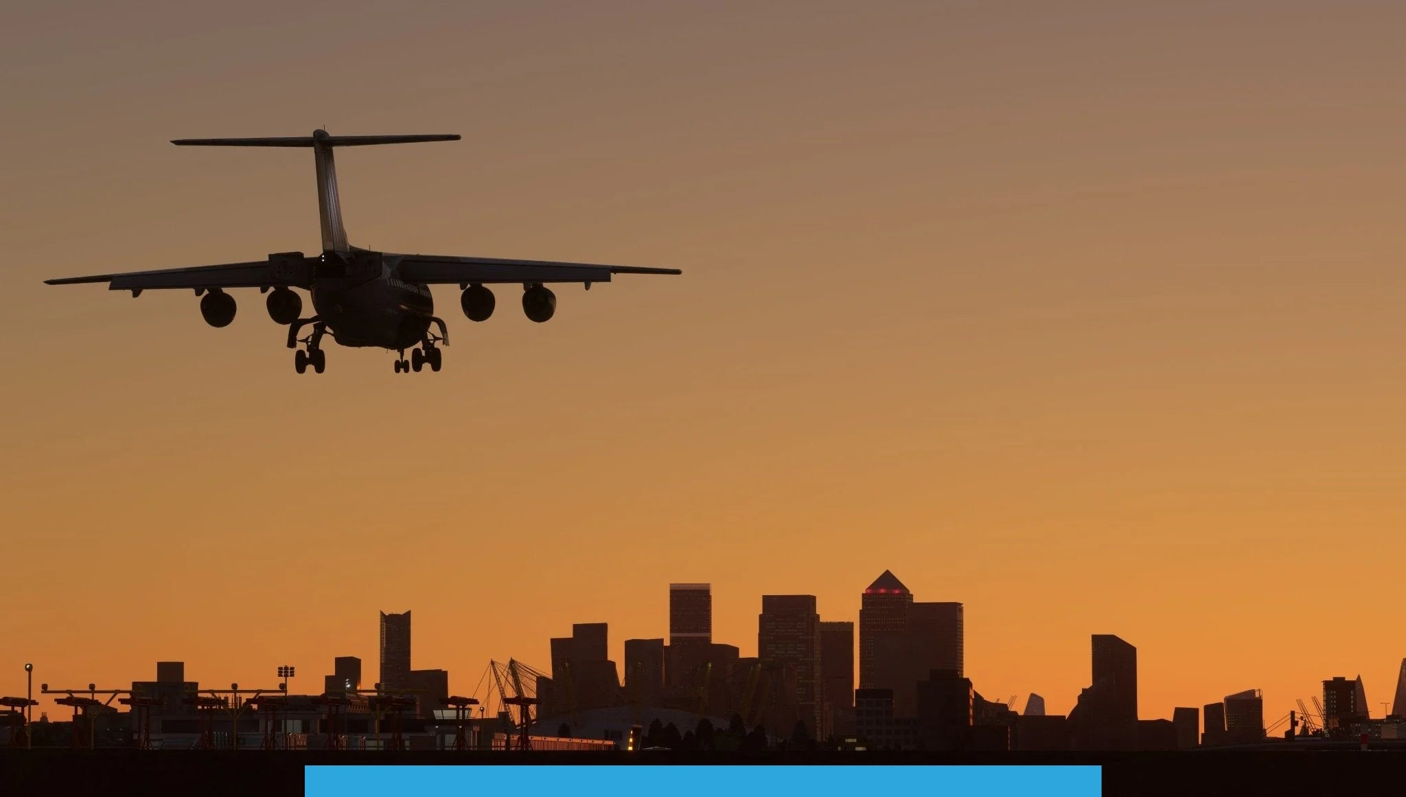 A silhouette of an airplane from the Just Flight BAE-146 Professional for MSFS2020 series lands at an airport against an orange sunset backdrop. In the distance, the skyline of a city looms with various skyscrapers outlined against the sky, reminiscent of a stunning Microsoft Flight Simulator 2020 experience.