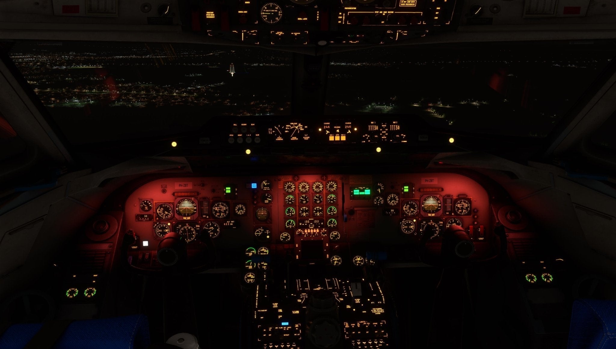 The cockpit view of a Just Flight Fokker-28 Professional for MSFS2020 at night reveals illuminated control panels, with the dark sky and city lights visible through the windows. This scene highlights numerous dials, buttons, and screens on the dashboard—a true Just Flight experience.