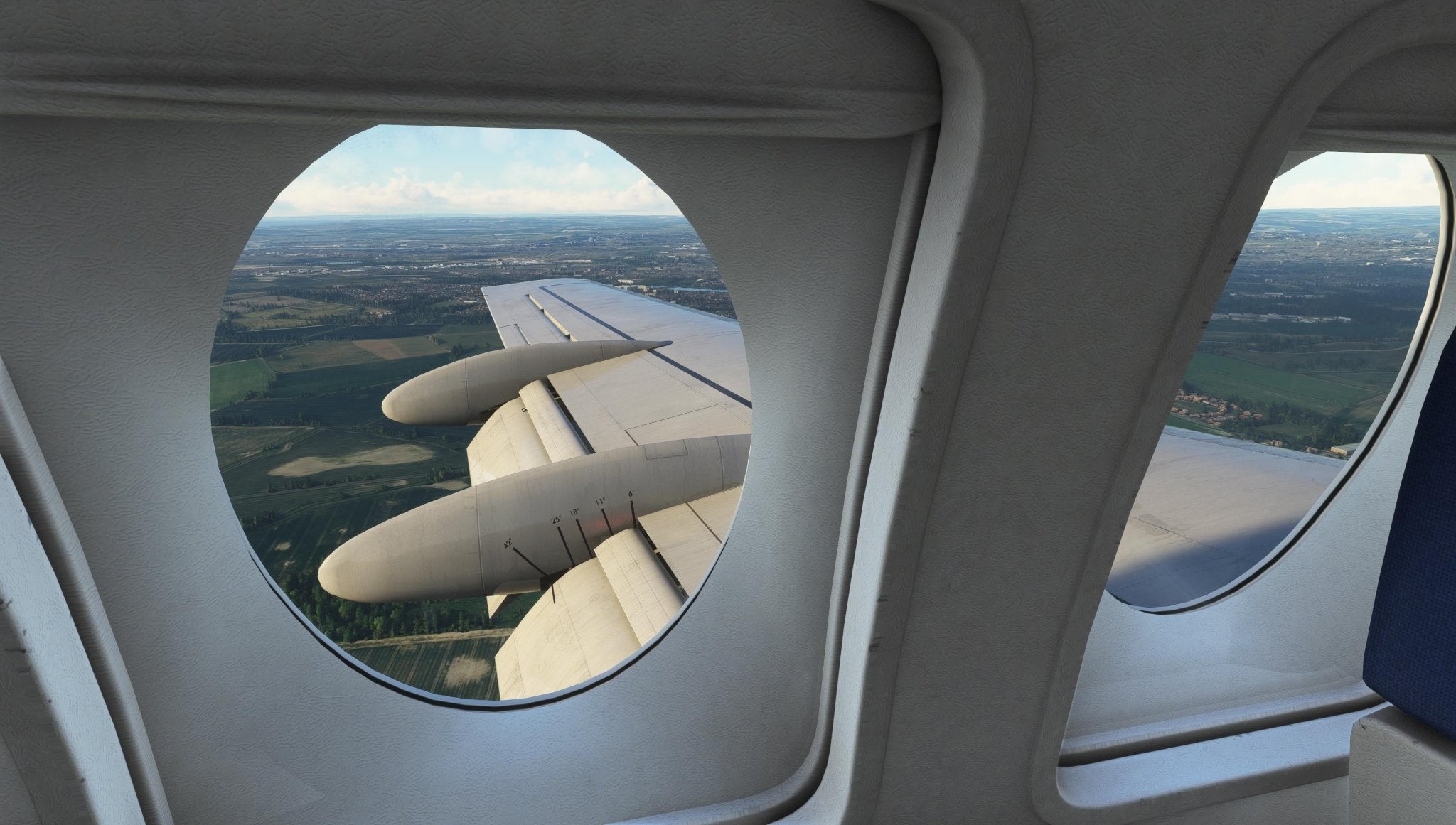 From an airplane window, take in the expansive landscape unfolding beneath the broad wing of the Just Flight Fokker-28 Professional for MSFS2020. The partly cloudy sky reveals fields and farmlands below. Interior details of the Just Flight plane's window and seat are subtly visible, enhancing the serene panorama.