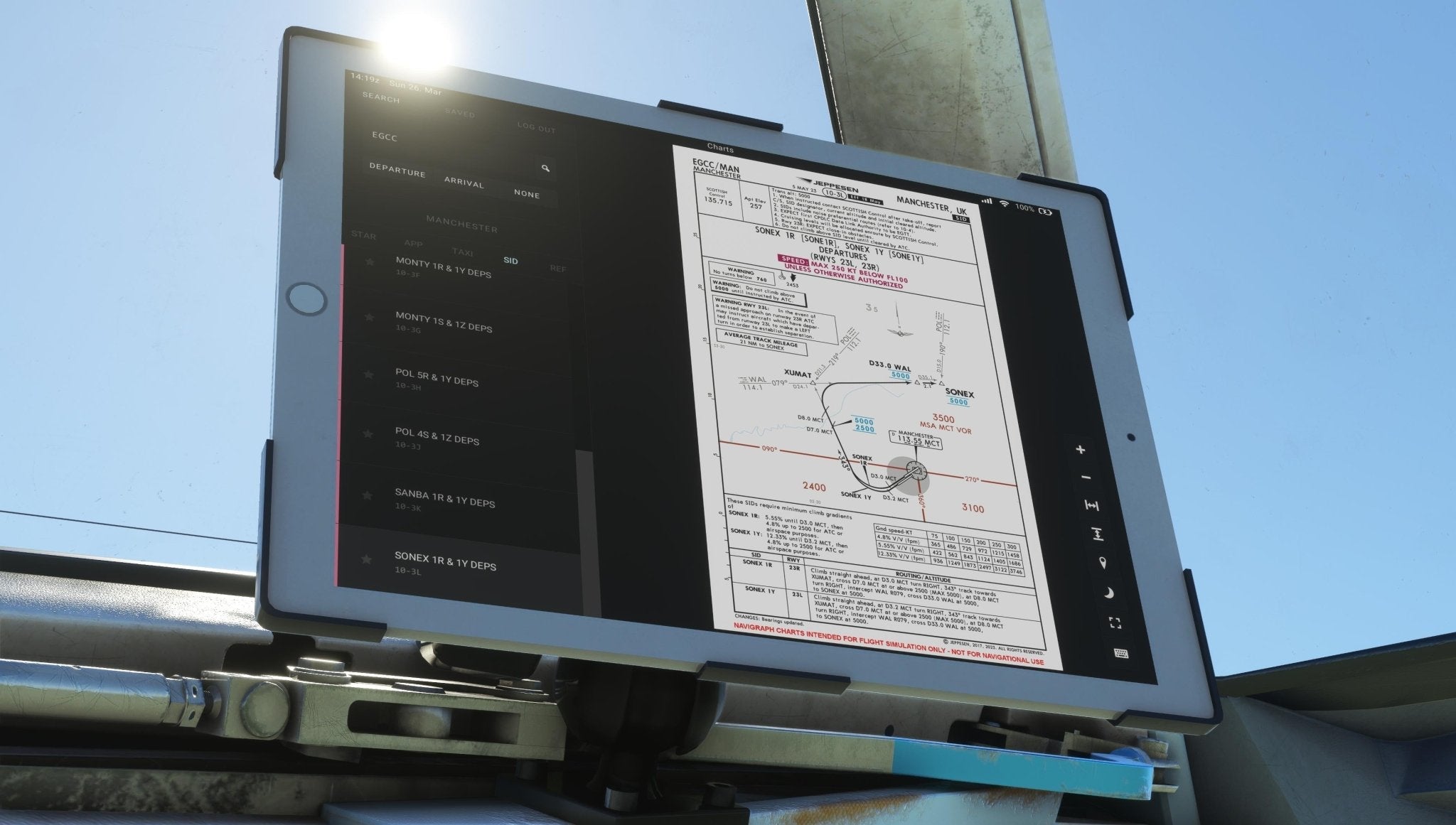 A tablet, securely mounted in the vehicle, displays an aviation navigation document with charts and diagrams for the Just Flight Fokker-28 Professional for MSFS2020. Through the window, a clear blue sky confirms it's daytime, enhancing the anticipation of flying an F28 regional jet.