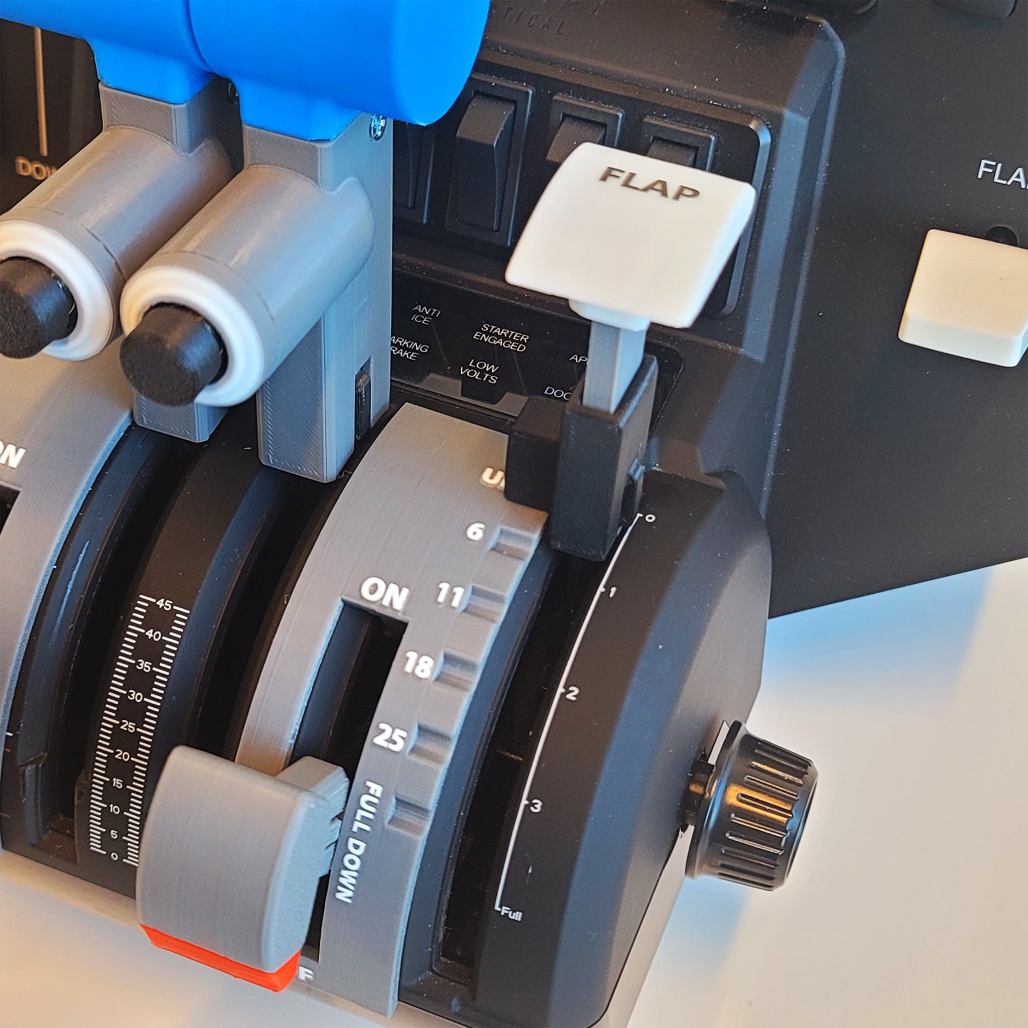 Close-up of aircraft cockpit controls showcasing Prodesksim's new Fokker 28 add-on for the Honeycomb Bravo throttle quadrant. The setup includes six levers with detent flaps, prominently marked "FLAP," and two functional buttons, all set on a panel featuring various dials and switches that highlight ProDeskSim's precision engineering.