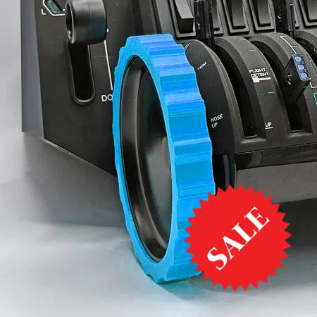Close-up of a Honeycomb Bravo Throttle Quadrant with a blue Prodesksim 1 Color Vibrant and Flexible Trim Wheel Cover attached to one of the levers. The cover features a textured rim that contrasts with the black simulator controls, enhancing your flight simulation experience.