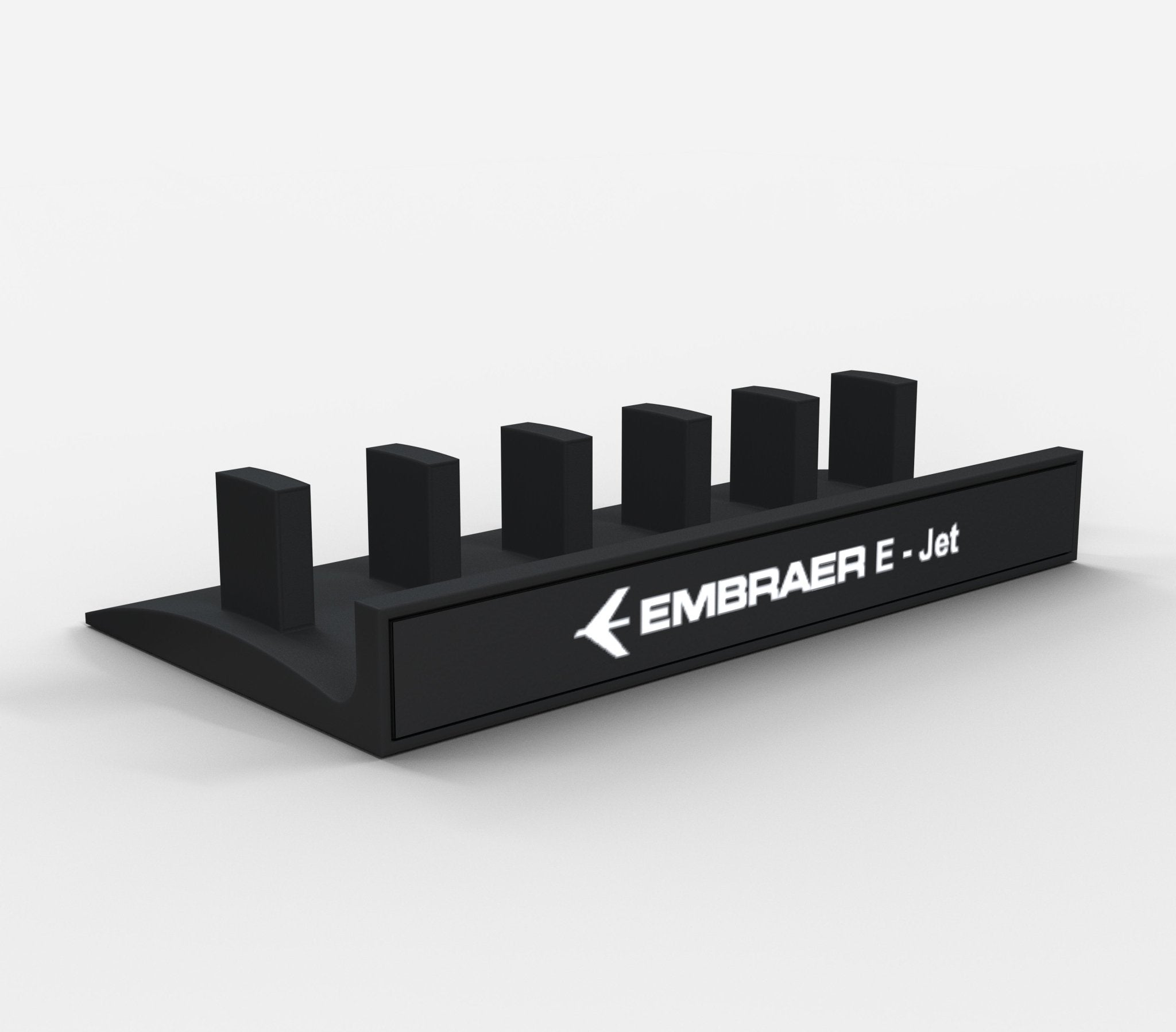 A black Honeycomb Bravo Add-on ORGANIZER by Prodesksim, designed to hold handles and levers, features the "EMBRAER E-Jet" text alongside six black rectangular pegs in a row. Its minimalist design incorporates an aircraft logo and is presented against a plain white background.