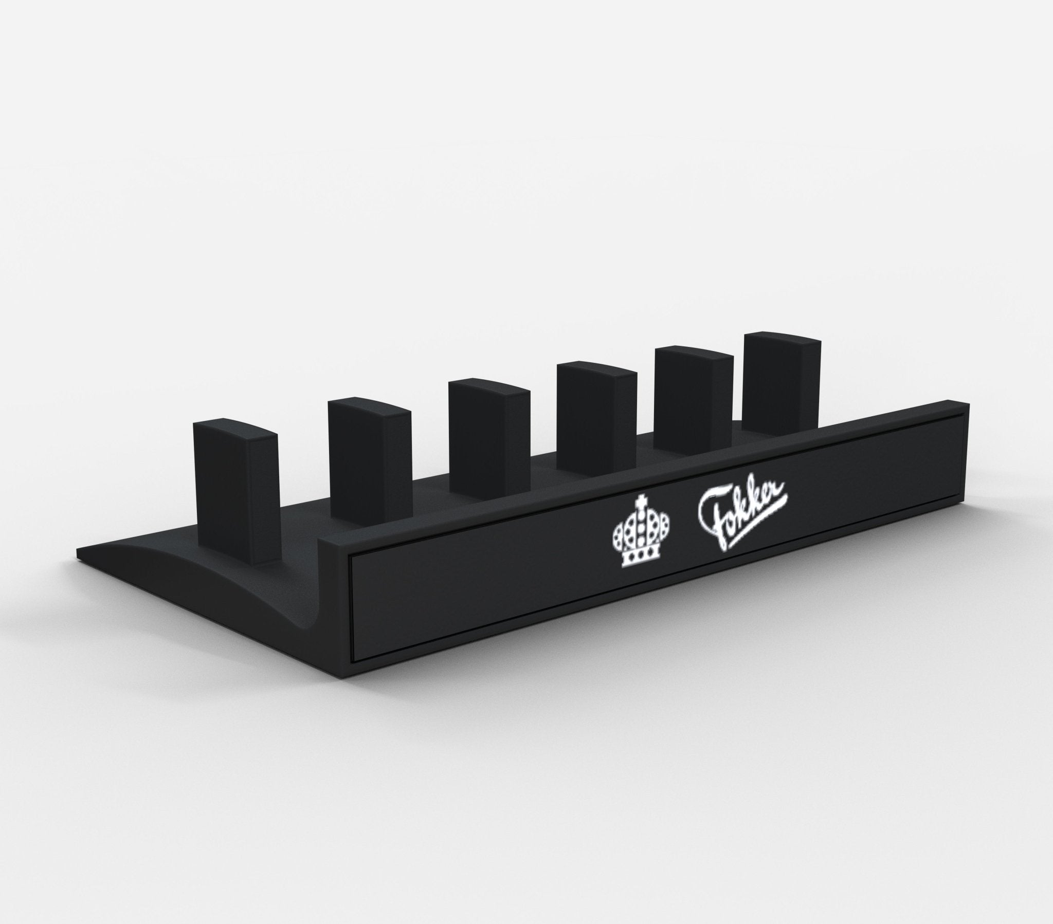 Introducing the Honeycomb Bravo Add-on ORGANZISER by Prodesksim, a sleek black stand/organizer with five slots and a slanted base, ideal for any desk setup. It features two striking logos: a crown on the left and a stylized signature on the right. This minimalistic organizer effortlessly complements professional spaces.