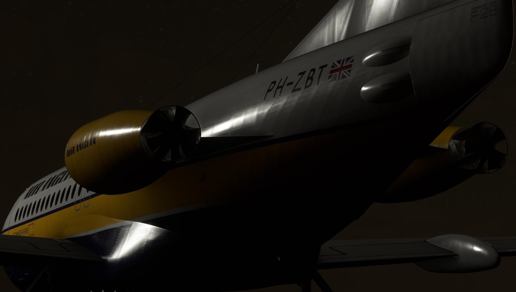 A close-up view of a Just Flight Fokker-28 Professional for MSFS2020 regional jet against a dark background, showcasing the tail, engines, and fuselage segment. The registration "PH-ZBT" and a British flag are visible. The aircraft features a livery in shades of yellow, white, and dark colors.