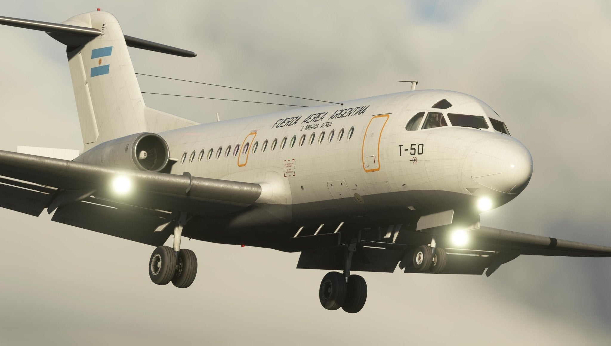 A white Just Flight Fokker-28 Professional for MSFS2020, marked "T-50" on the nose, soars through a cloudy sky with its landing gear deployed. An Argentine flag is prominently displayed on the tail, and bright lights illuminate the wings and fuselage as this regional jet demonstrates its capabilities.