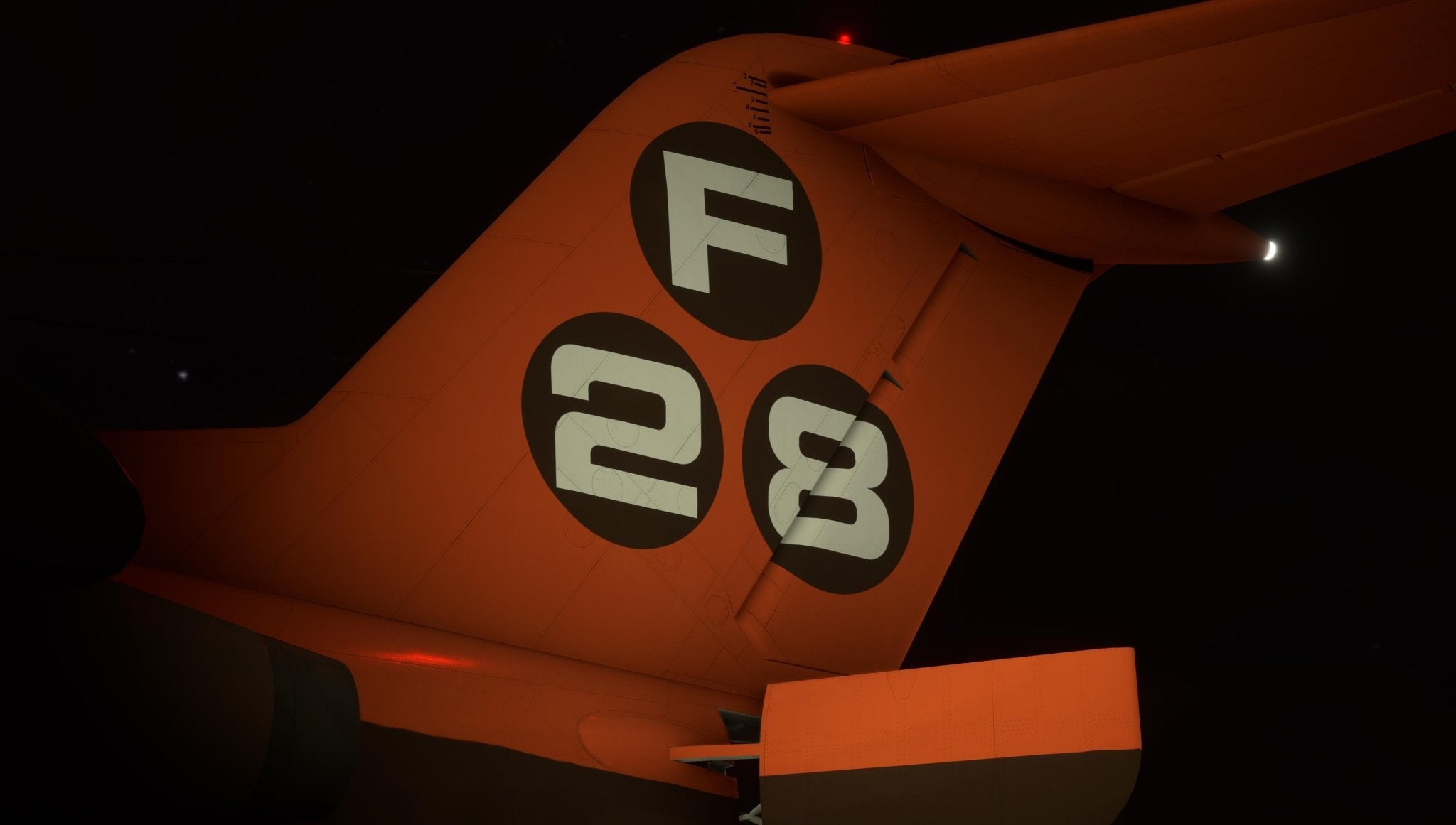 A captivating close-up of a Just Flight Fokker-28 Professional for MSFS2020 regional jet's tail fin at night, featuring the numbers 28 and the letter F in white on black circular backgrounds against its vibrant orange surface. This model from Just Flight is partially illuminated by a small red light at the top, adding mystery to the scene.